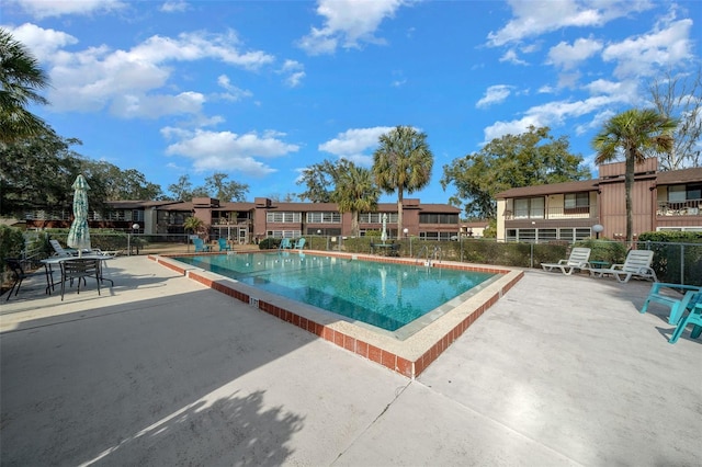 view of swimming pool featuring a patio area