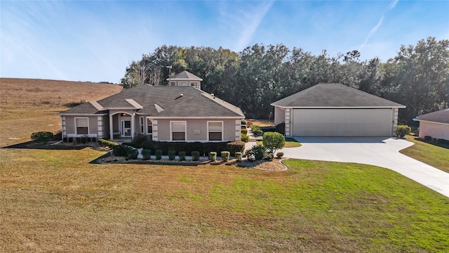 view of front of property with a garage and a front yard