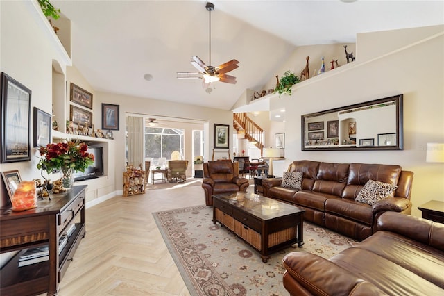 living room featuring ceiling fan, high vaulted ceiling, and light parquet flooring