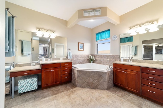 bathroom featuring vanity, tile patterned flooring, and separate shower and tub