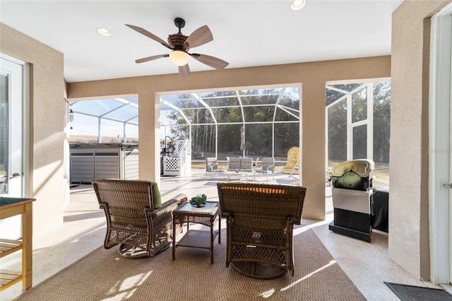 sunroom / solarium with ceiling fan