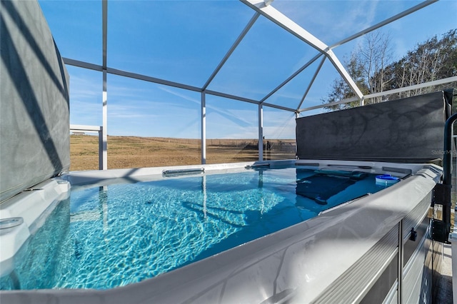 view of pool featuring a lanai