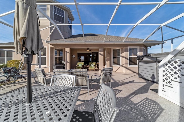 view of patio / terrace with a lanai and ceiling fan