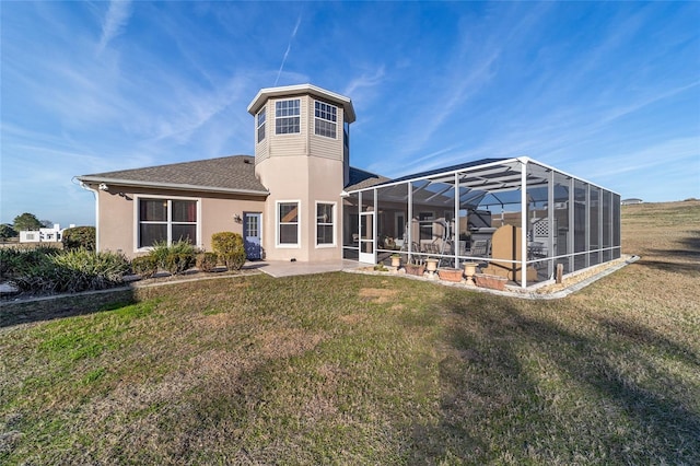 back of house featuring a yard, a patio, and glass enclosure