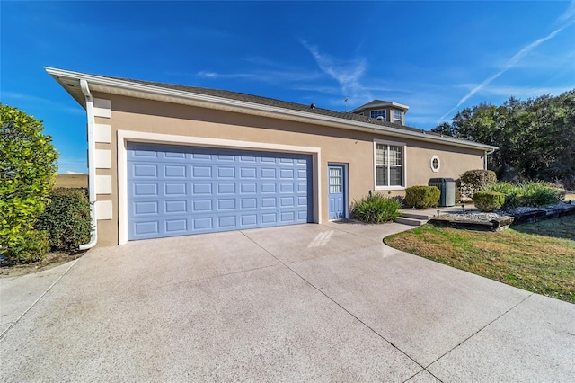 ranch-style house featuring a garage