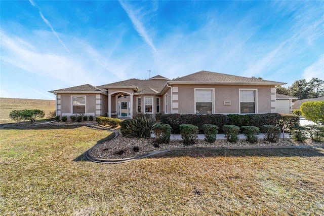 ranch-style house with a front yard