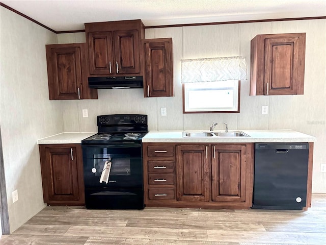 kitchen with crown molding, sink, light hardwood / wood-style flooring, and black appliances