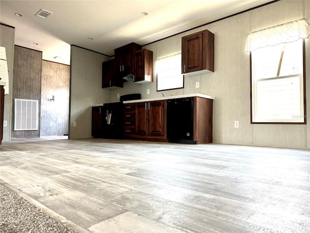 kitchen featuring dishwasher, dark brown cabinets, exhaust hood, and light hardwood / wood-style flooring