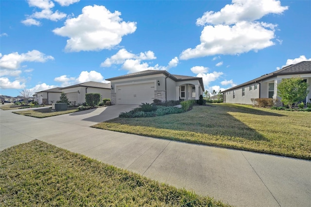 ranch-style home with a garage and a front lawn