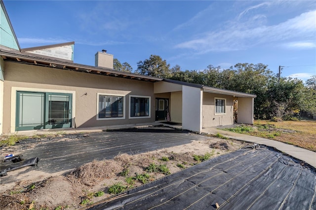 rear view of property with a deck