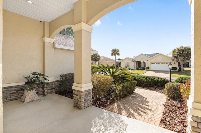 view of patio with a garage