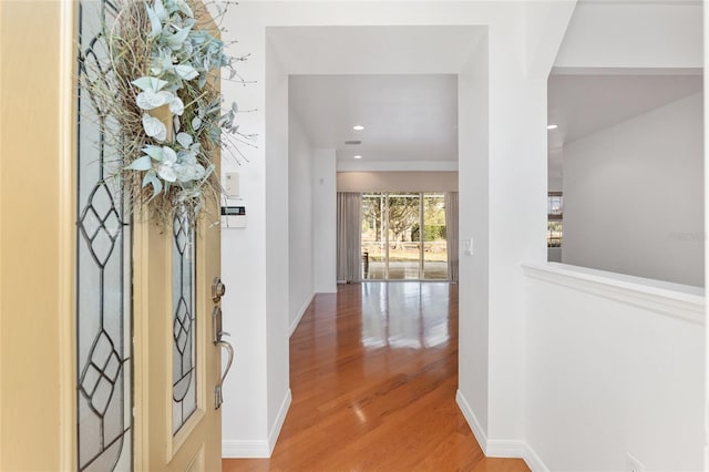 corridor featuring hardwood / wood-style floors