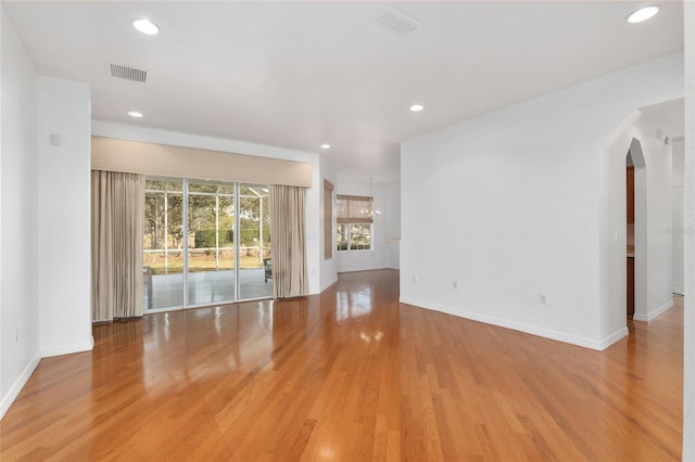 unfurnished living room featuring light hardwood / wood-style flooring