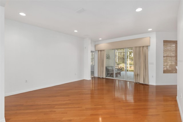 spare room with light hardwood / wood-style floors