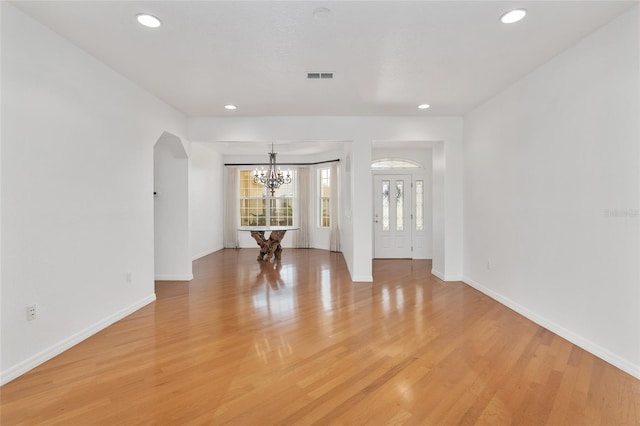 interior space with light hardwood / wood-style flooring and a chandelier