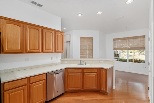 kitchen with sink, hanging light fixtures, stainless steel dishwasher, kitchen peninsula, and light wood-type flooring