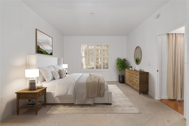 bedroom with light colored carpet