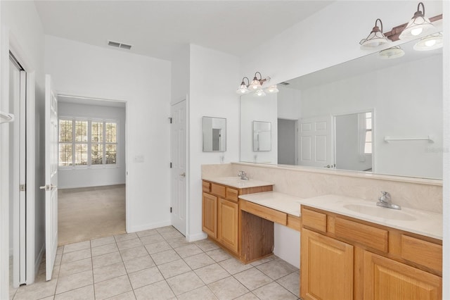 bathroom with vanity and tile patterned flooring