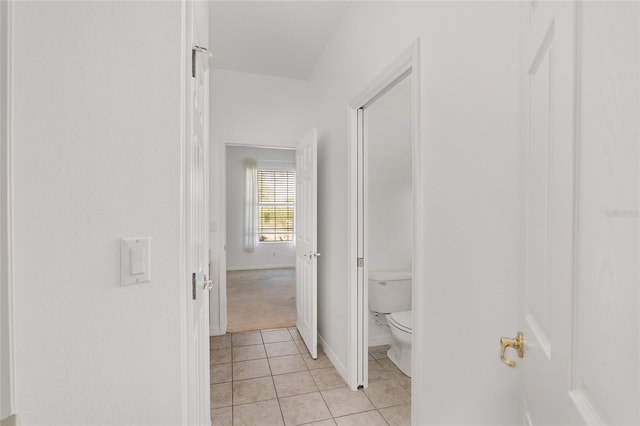 bathroom with tile patterned floors and toilet