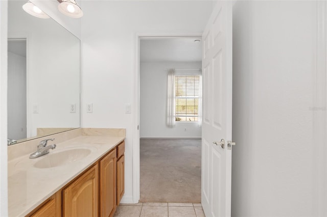 bathroom with tile patterned flooring and vanity