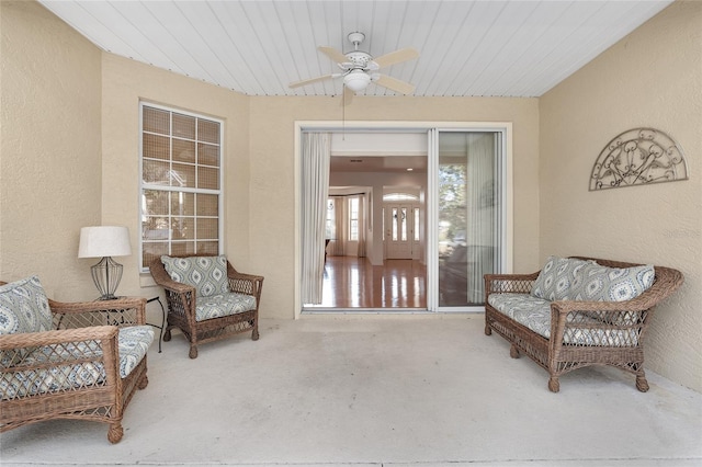 property entrance with ceiling fan and a patio area