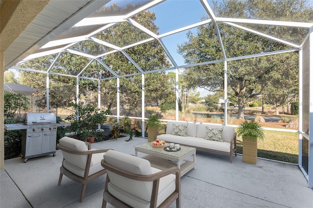 view of patio featuring a lanai, area for grilling, and outdoor lounge area