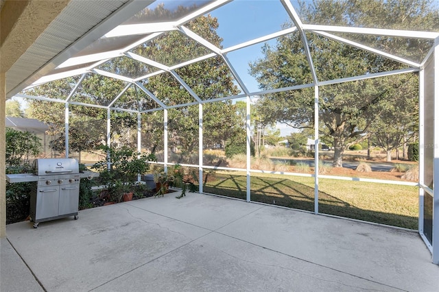 view of patio featuring a lanai and a grill