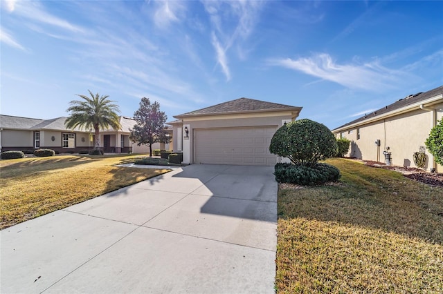 view of front of house with a garage and a front yard