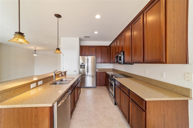 kitchen with sink, decorative light fixtures, light tile patterned floors, stainless steel appliances, and light stone countertops