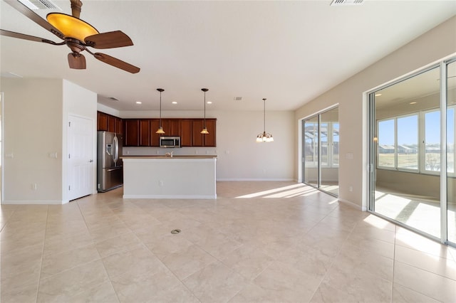 unfurnished living room with light tile patterned flooring and ceiling fan with notable chandelier