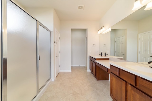 bathroom with vanity and an enclosed shower