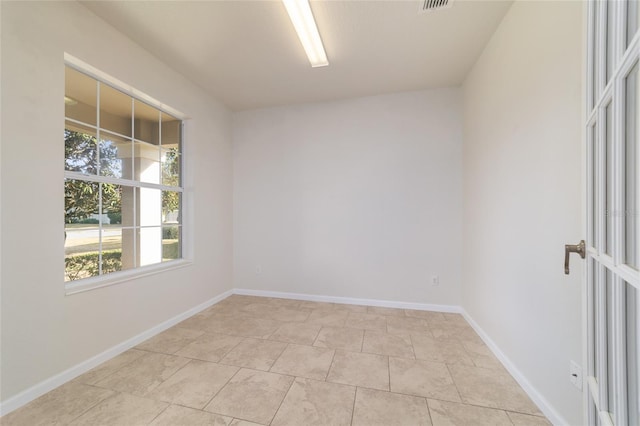 spare room with light tile patterned flooring