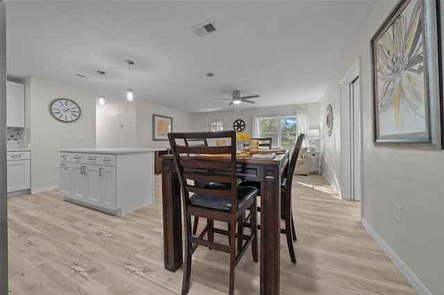 dining area featuring ceiling fan and light hardwood / wood-style floors