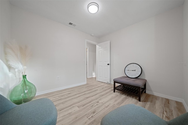 sitting room featuring light wood-type flooring