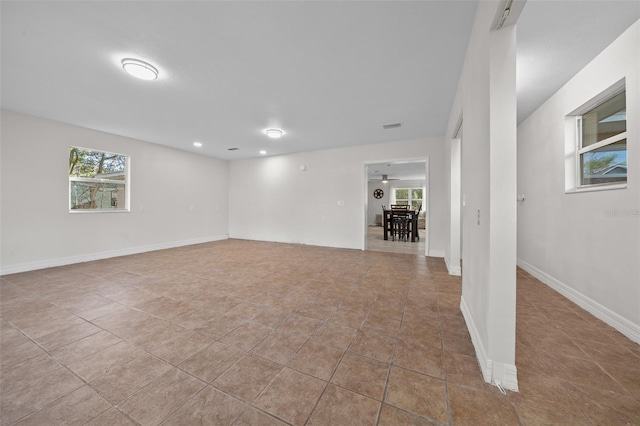 unfurnished room with light tile patterned floors