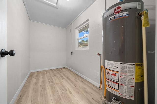 utility room featuring water heater