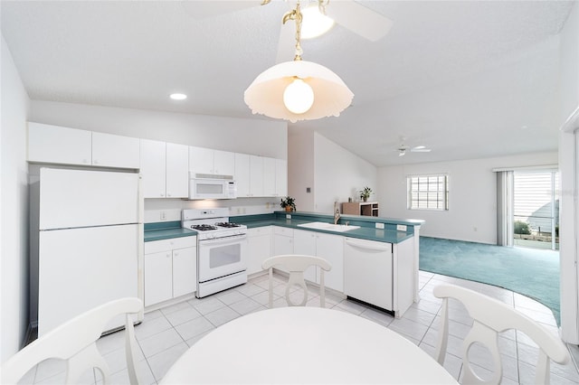 kitchen featuring ceiling fan, sink, white cabinets, and white appliances