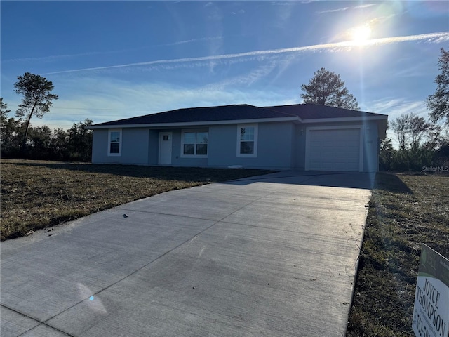 single story home featuring a garage