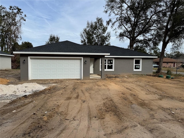 ranch-style home with a garage