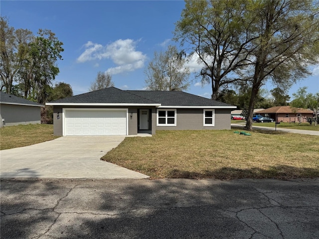 ranch-style home featuring stucco siding, driveway, an attached garage, and a front yard