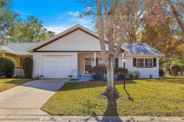 ranch-style house with a garage, a front lawn, and covered porch