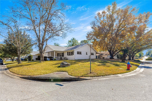 ranch-style home with a front yard