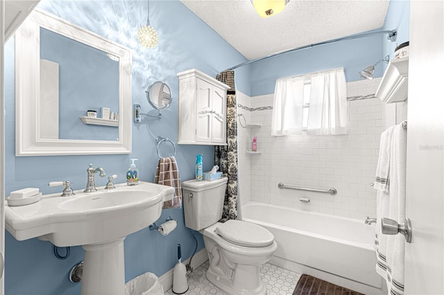 bathroom with shower / tub combo with curtain, toilet, and a textured ceiling