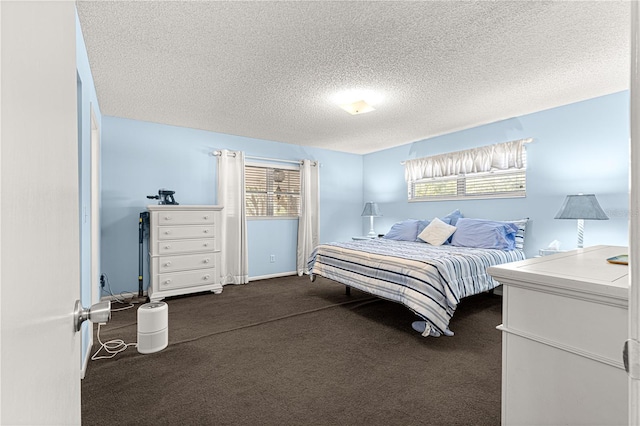 carpeted bedroom with a textured ceiling