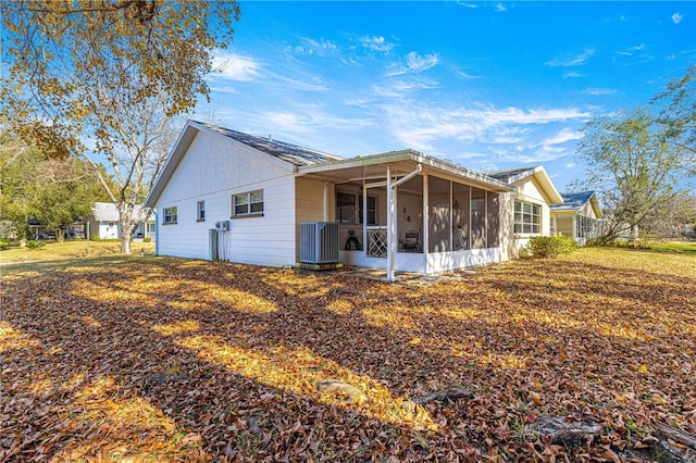 rear view of house with a sunroom