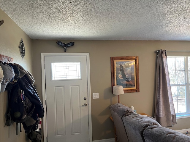 foyer with a textured ceiling