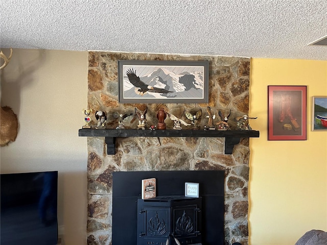 details with a fireplace and a textured ceiling