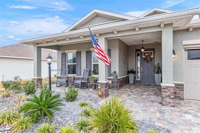 property entrance featuring a porch