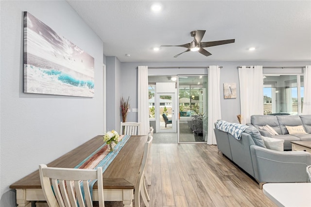 interior space with a textured ceiling, light hardwood / wood-style flooring, and ceiling fan