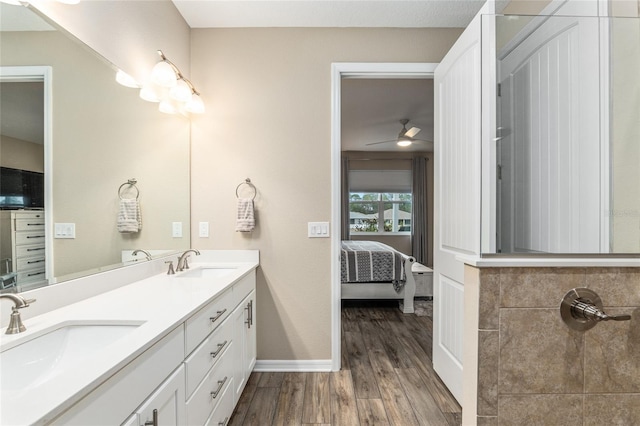 bathroom featuring vanity, wood-type flooring, and ceiling fan